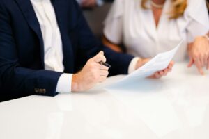 Property manager and resident reviewing a lease and maintenance checklist at a rental home.
